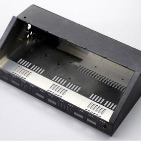 black metal enclosure with a slanted front and multiple ventilation slots